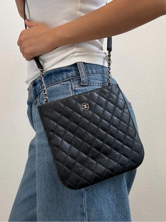CHANEL Black Quilted. Calfskin Leather. Crossbody with CC coin. - Picture 1 of 4